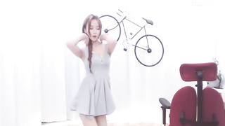 Enrapturing dark haired in a supah brief sundress is dancing in front of the web camera