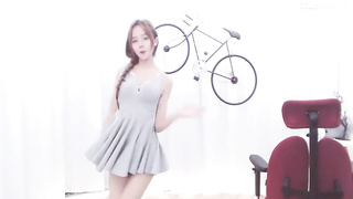 Enrapturing dark haired in a supah brief sundress is dancing in front of the web camera