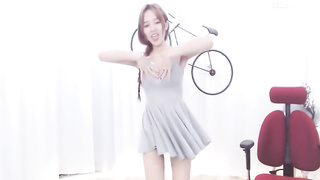Enrapturing dark haired in a supah brief sundress is dancing in front of the web camera