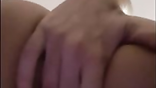 First-Timer honey is massaging her cunt in front of the camera and bellowing while jizzing