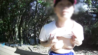 Smallish boobed, Asian stunner is demonstrating her milk cans in a public place, just for joy