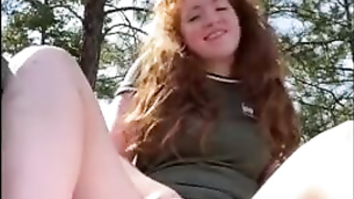 Crimson haired stunner is draining during a hiking excursion and shrieking from sensation during an ejaculation