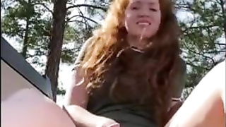 Crimson haired stunner is draining during a hiking excursion and shrieking from sensation during an ejaculation