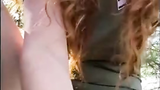 Crimson haired stunner is draining during a hiking excursion and shrieking from sensation during an ejaculation