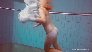 Crimson haired honey, Dashka is oftentimes swimming downright bare, not knowing that someone is eyeing her