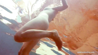 Crimson haired honey, Dashka is oftentimes swimming downright bare, not knowing that someone is eyeing her